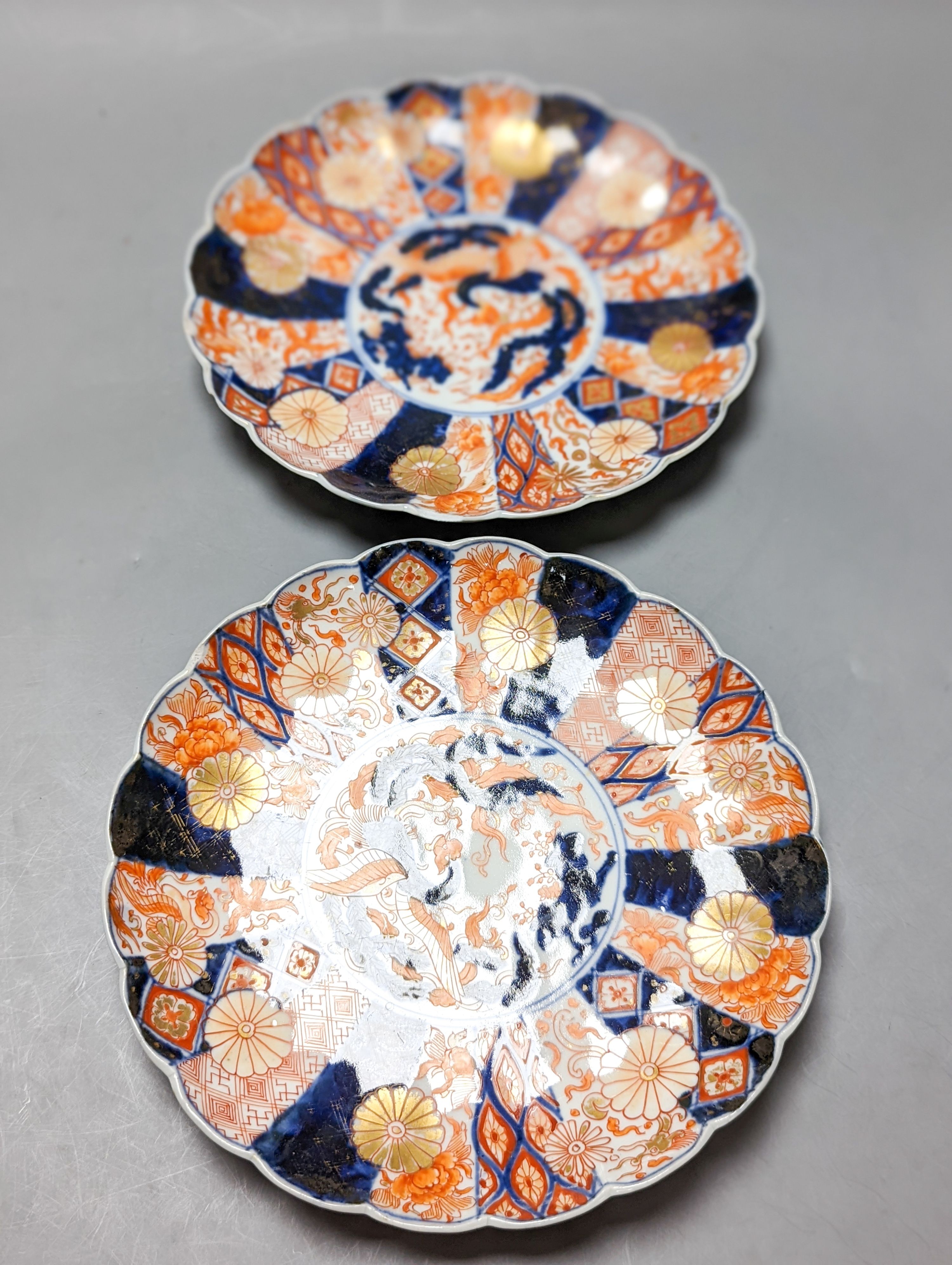 A 19th century Chinese porcelain bowl, transfer printed pillow, a Japanese Imari jar and cover and three Imari plates 21cm